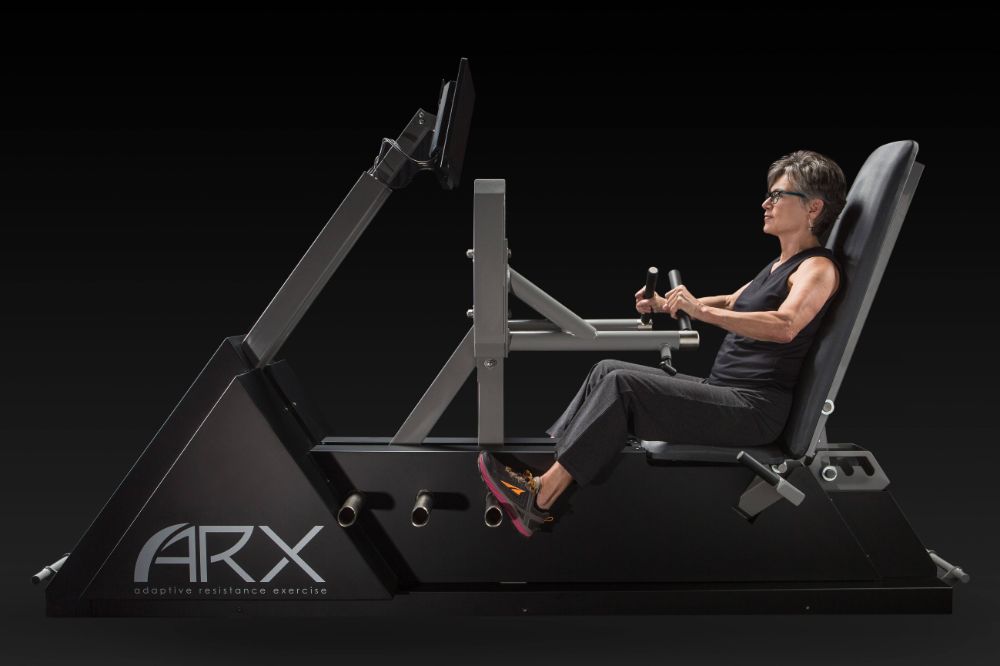 An active adult training on the ARX adaptive-resistance machine at BioHack Studios in St. Petersburg