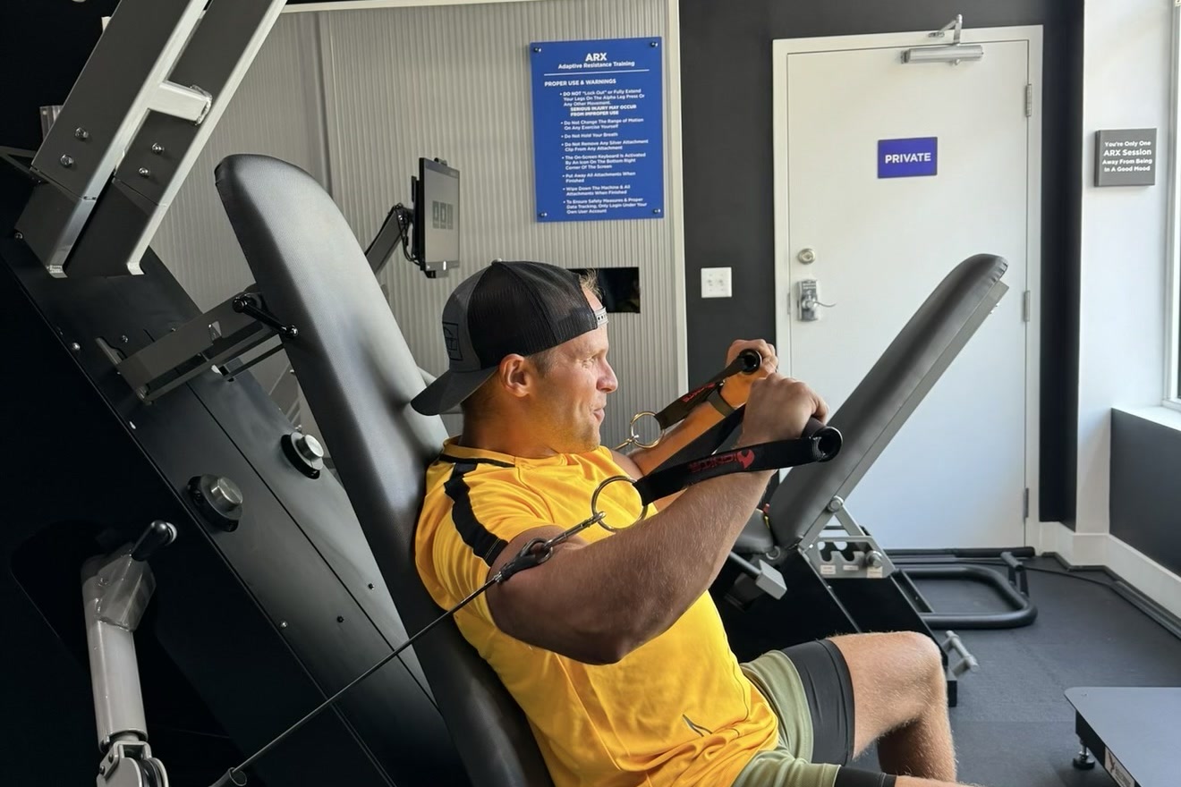 A member training on the ARX chest press at BioHack Studios in St. Petersburg