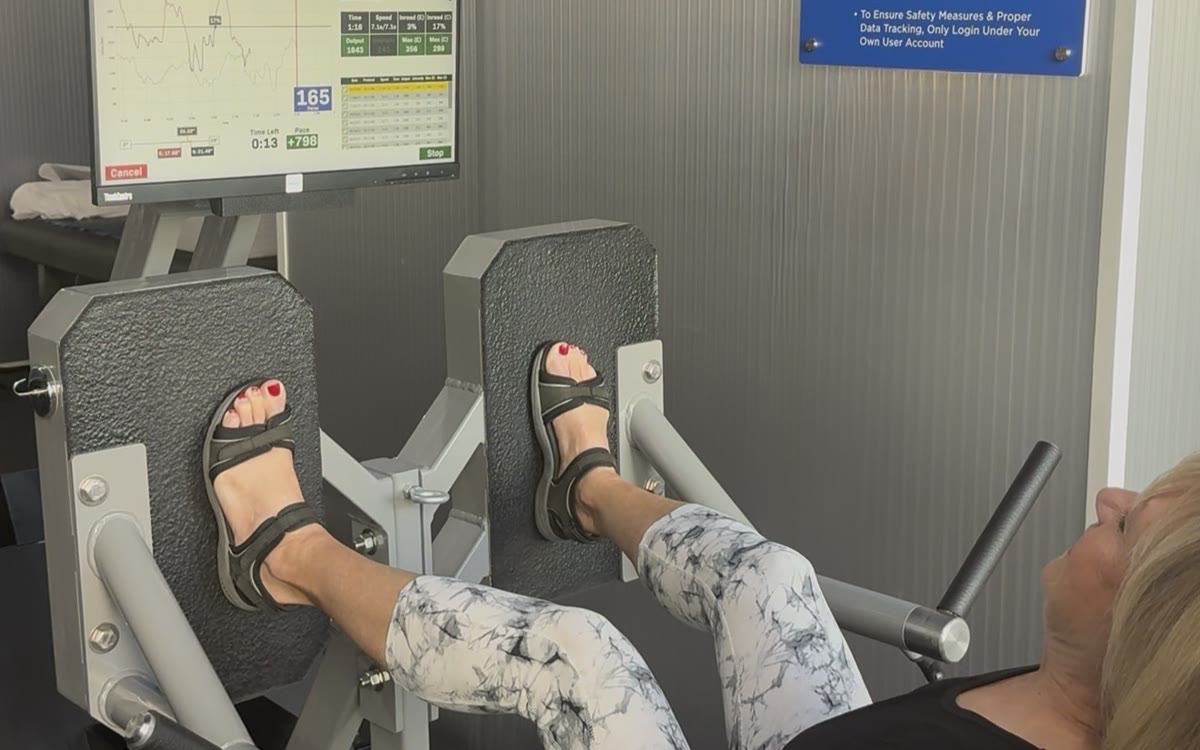 An active adult training on the ARX leg press at BioHack Studios in St. Petersburg